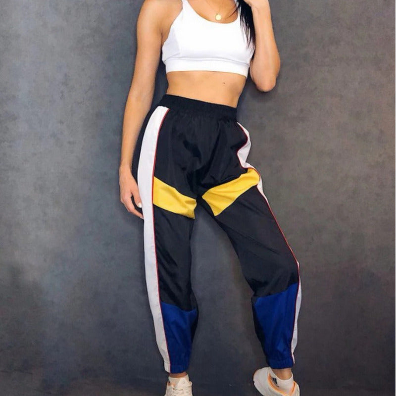 Pantalon dama Nylon negriazul con franja Amarilla