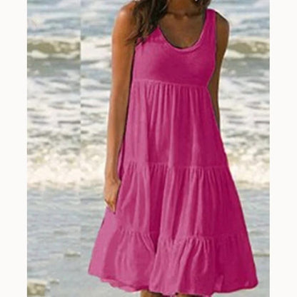 Vestido corto de mujer casual, cuello redondo, sin mangas, con volados. Estilo boho, liso, ideal para playa y verano. Modelo holgado oversize.