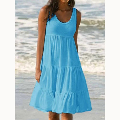 Vestido corto de mujer casual, cuello redondo, sin mangas, con volados. Modelo holgado oversize.