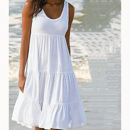 Vestido corto de mujer casual, cuello redondo, sin mangas, con volados. Modelo holgado oversize.