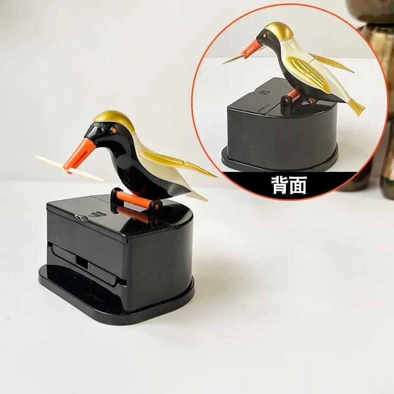 Dispenser automático de palillos con diseño de pajarito. 