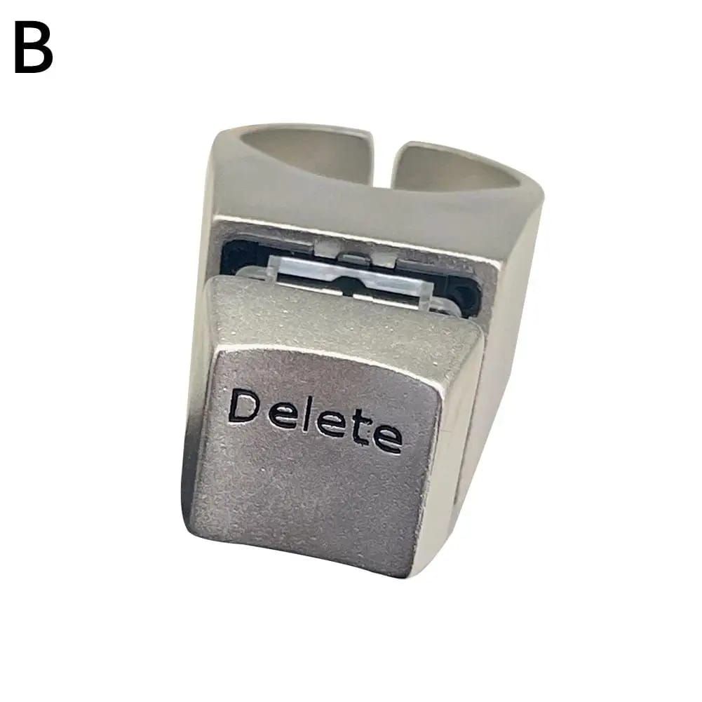 Anillo con diseño de tecla 'Delete' de teclado, ideal para amantes de la informática y la cultura geek. Un accesorio original de metal.