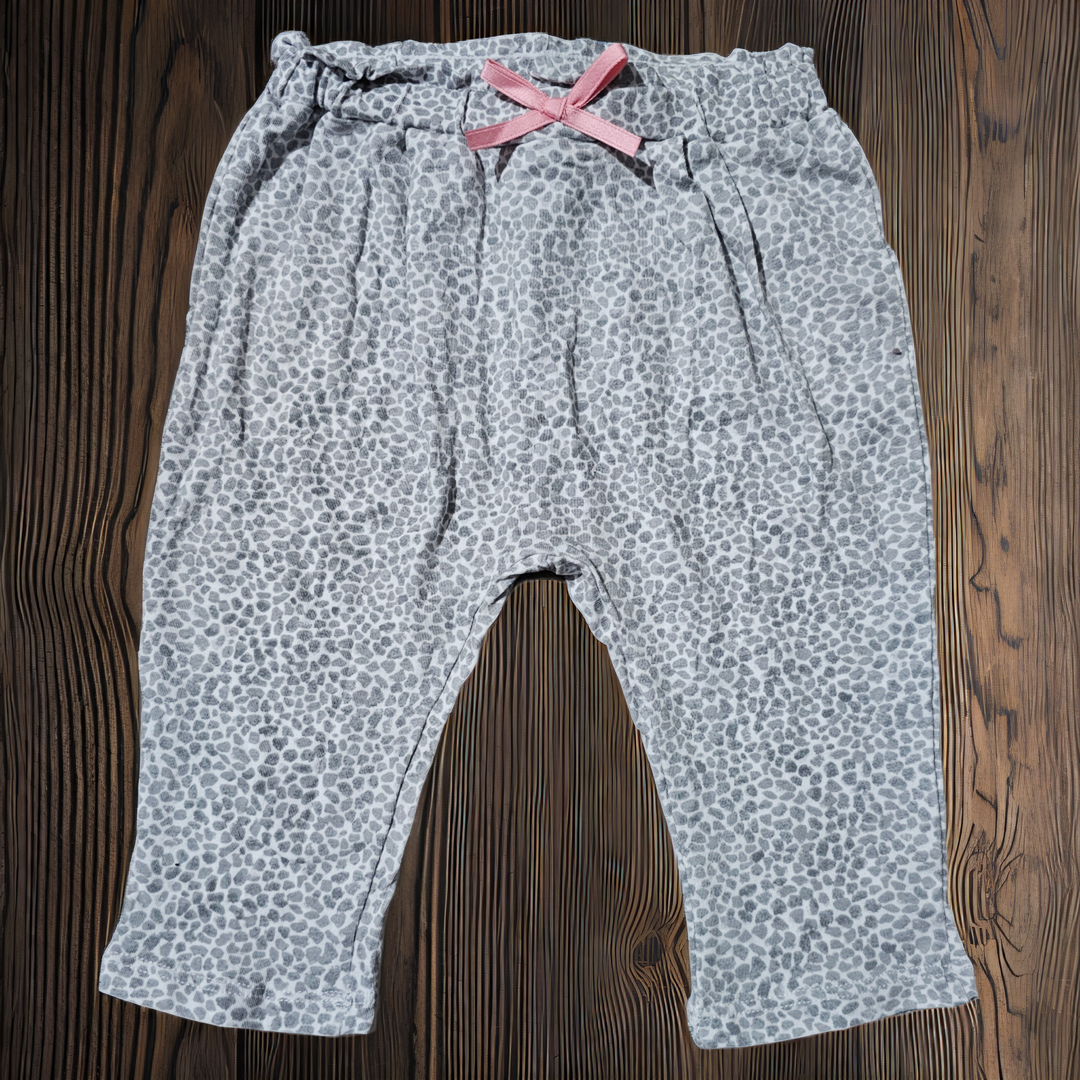 Pantalon niña tipo calza leopardo con moña