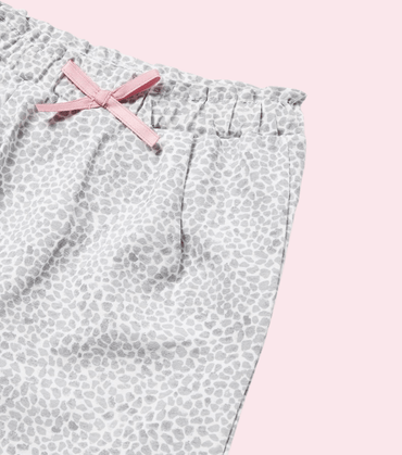 Pantalon niña tipo calza leopardo con moña