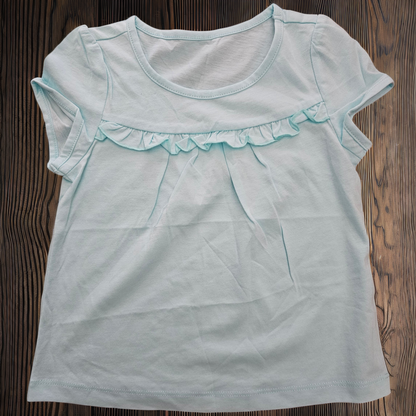 Remera niña lisa manga con volado